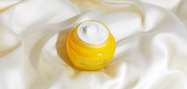 Divine cream sitting on silk fabric
